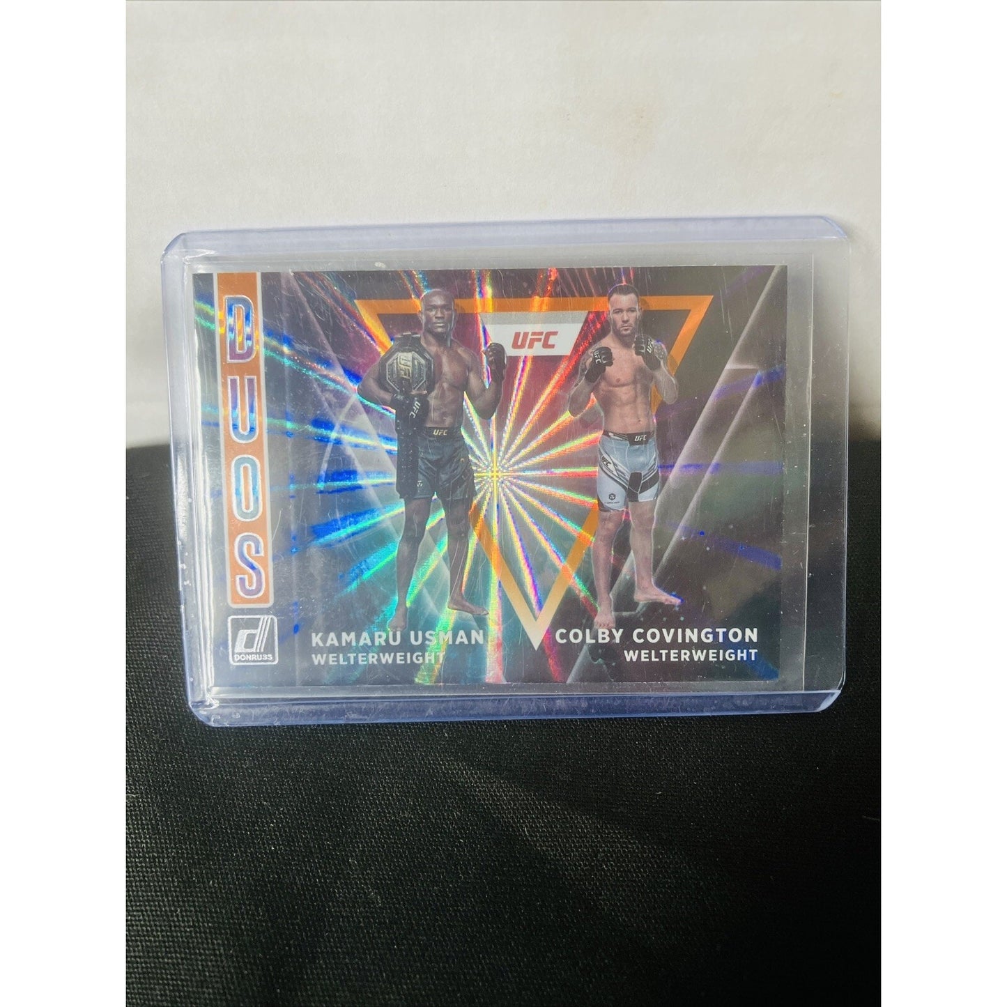 2022 Panini Donruss UFC Duos #4 Kamaru Usman Colby Covington Orange Laser Holo