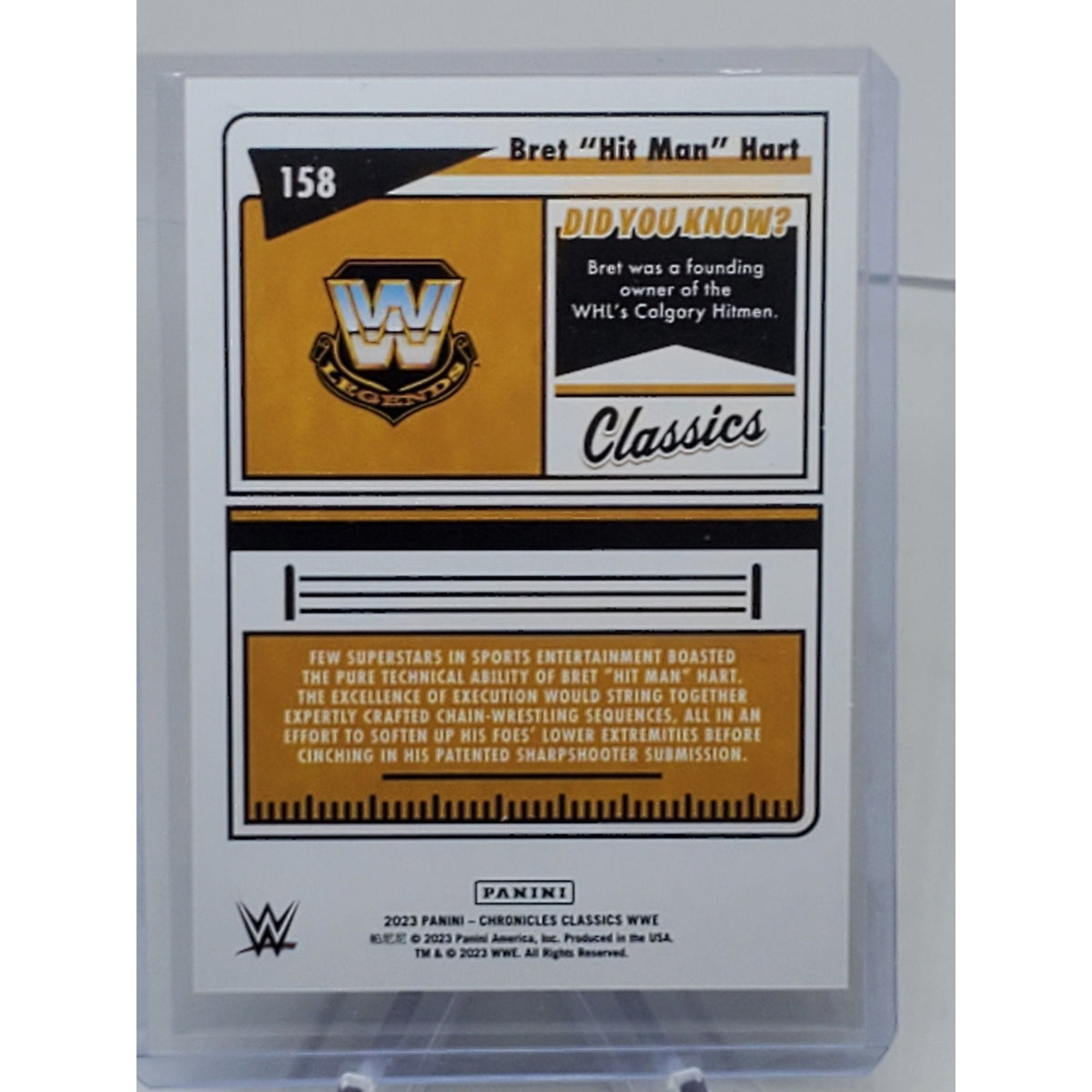 2023 Panini Chronicles WWE Bret "Hit Man" Hart #/99 Blue Parallel SP 158