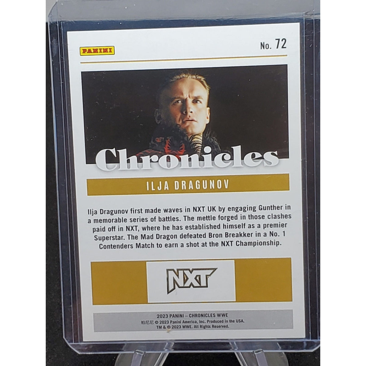 2023 Panini Chronicles WWE Ilja Dragunov Pink #/349