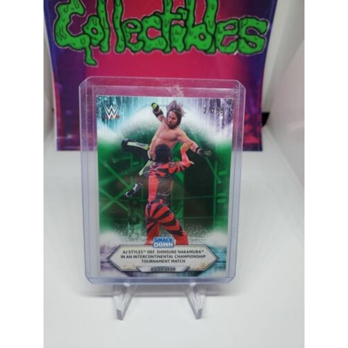 2021 Topps WWE AJ Styles Defeats Shinsuke Nakamura #76 #/99