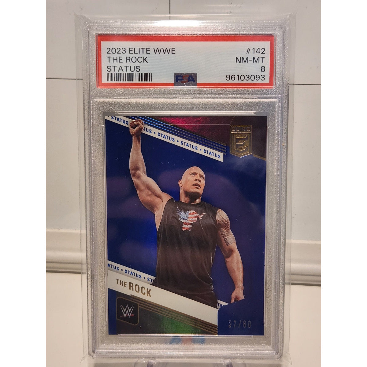 THE ROCK 2023 DONRUSS ELITE WWE SP BLUE STATUS #74/80 PSA 8