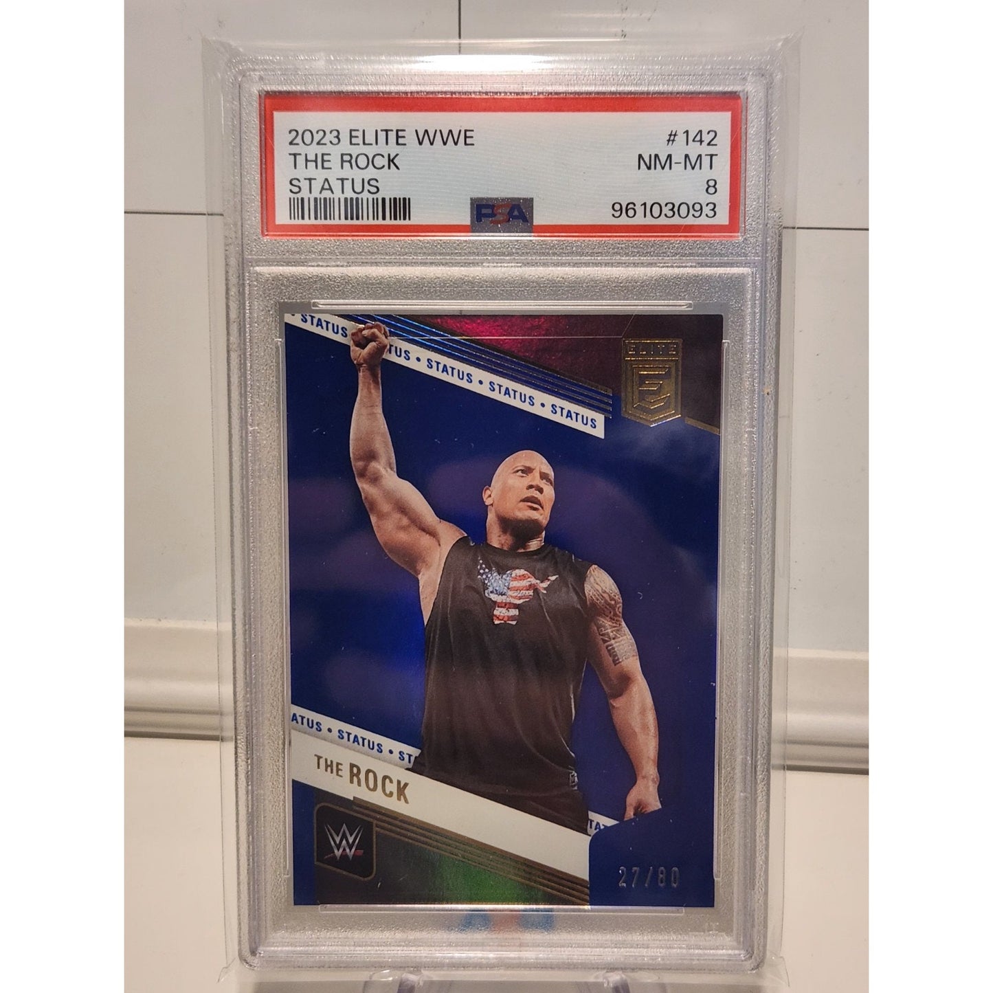 THE ROCK 2023 DONRUSS ELITE WWE SP BLUE STATUS #74/80 PSA 8
