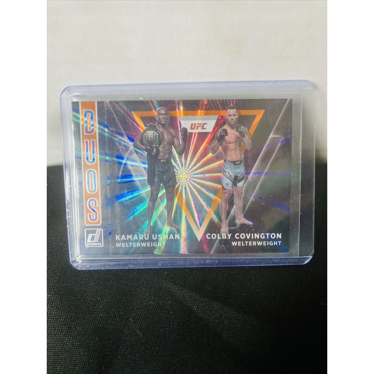 2022 Panini Donruss UFC Duos #4 Kamaru Usman Colby Covington Orange Laser Holo