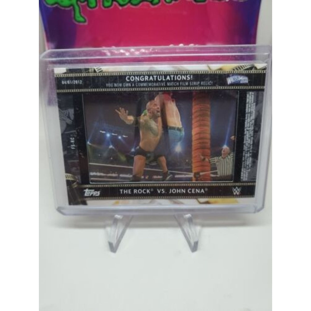 2021 Topps WWE The Rock vs John Cena Film Strip Relic Yellow 21/75 mint