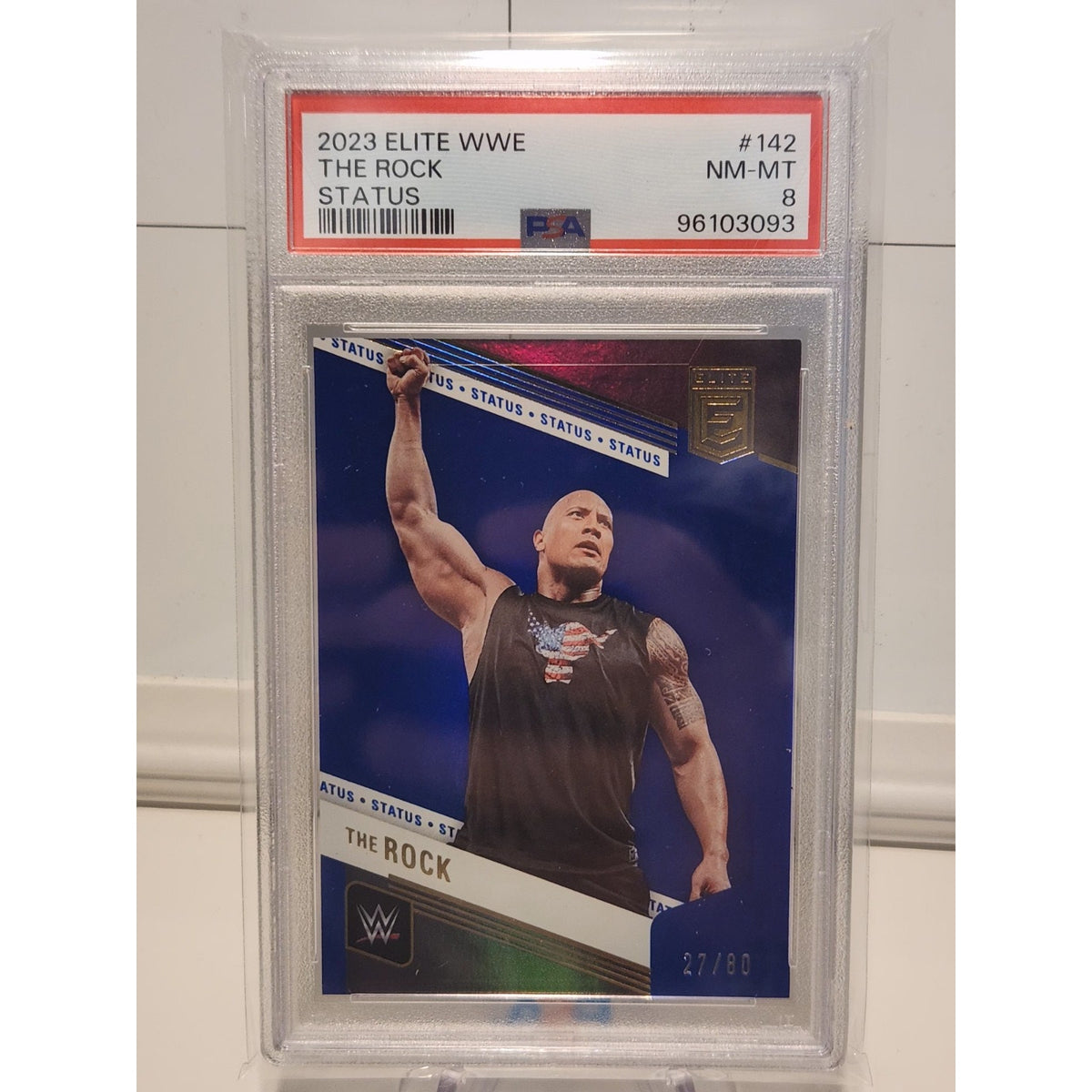 THE ROCK 2023 DONRUSS ELITE WWE SP BLUE STATUS #74/80 PSA 8