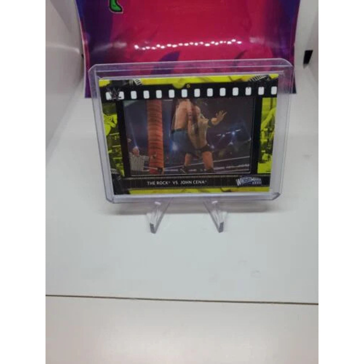 2021 Topps WWE The Rock vs John Cena Film Strip Relic Yellow 21/75 mint