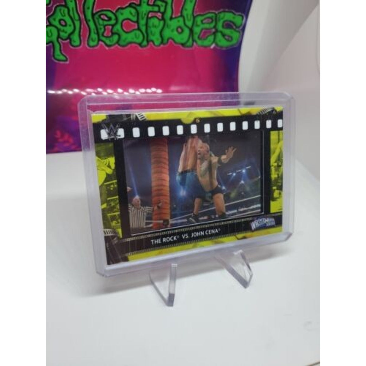2021 Topps WWE The Rock vs John Cena Film Strip Relic Yellow 21/75 mint