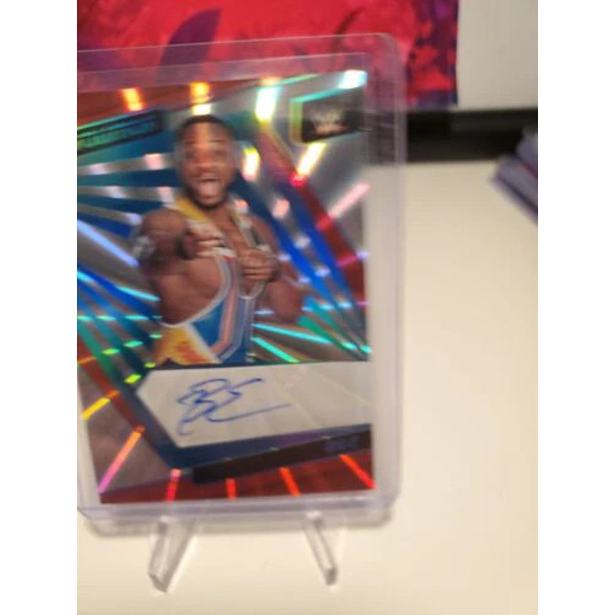 BIG E - 2022 PANINI REVOLUTION WWE SUNBURST AUTO #81/99 NEWDAY