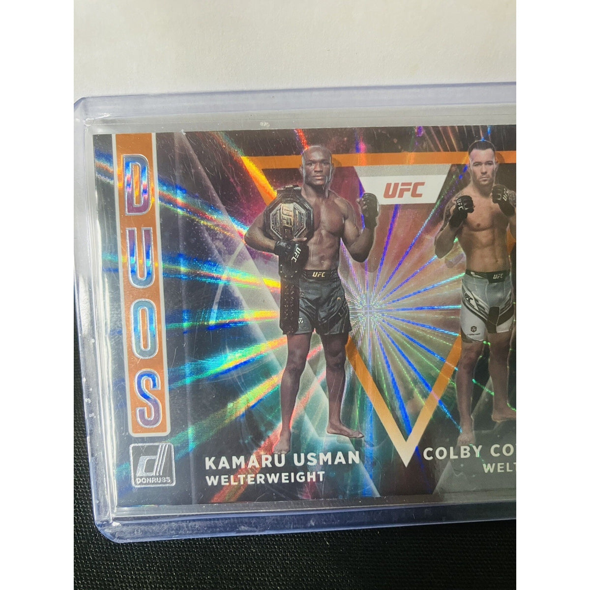 2022 Panini Donruss UFC Duos #4 Kamaru Usman Colby Covington Orange Laser Holo