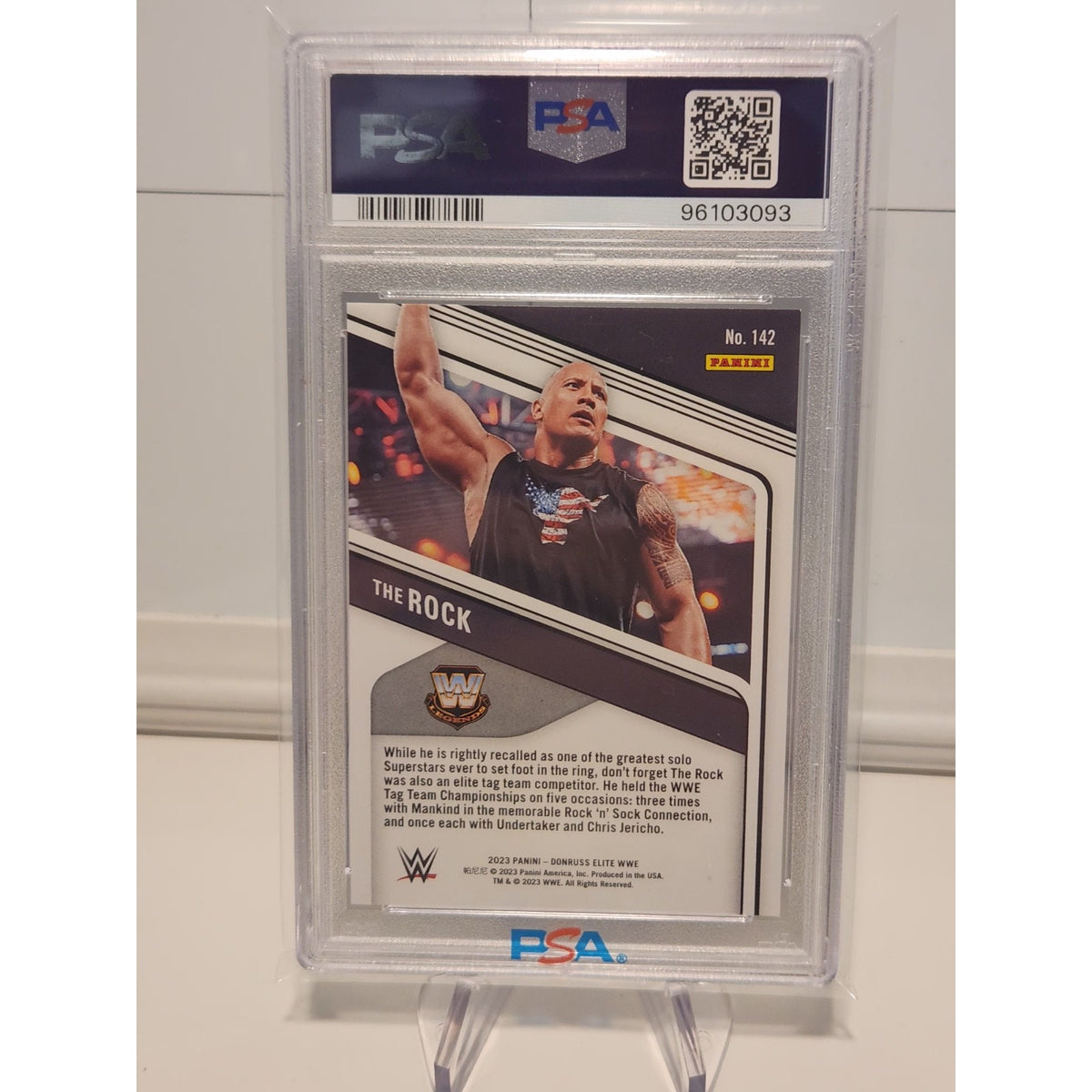 THE ROCK 2023 DONRUSS ELITE WWE SP BLUE STATUS #74/80 PSA 8