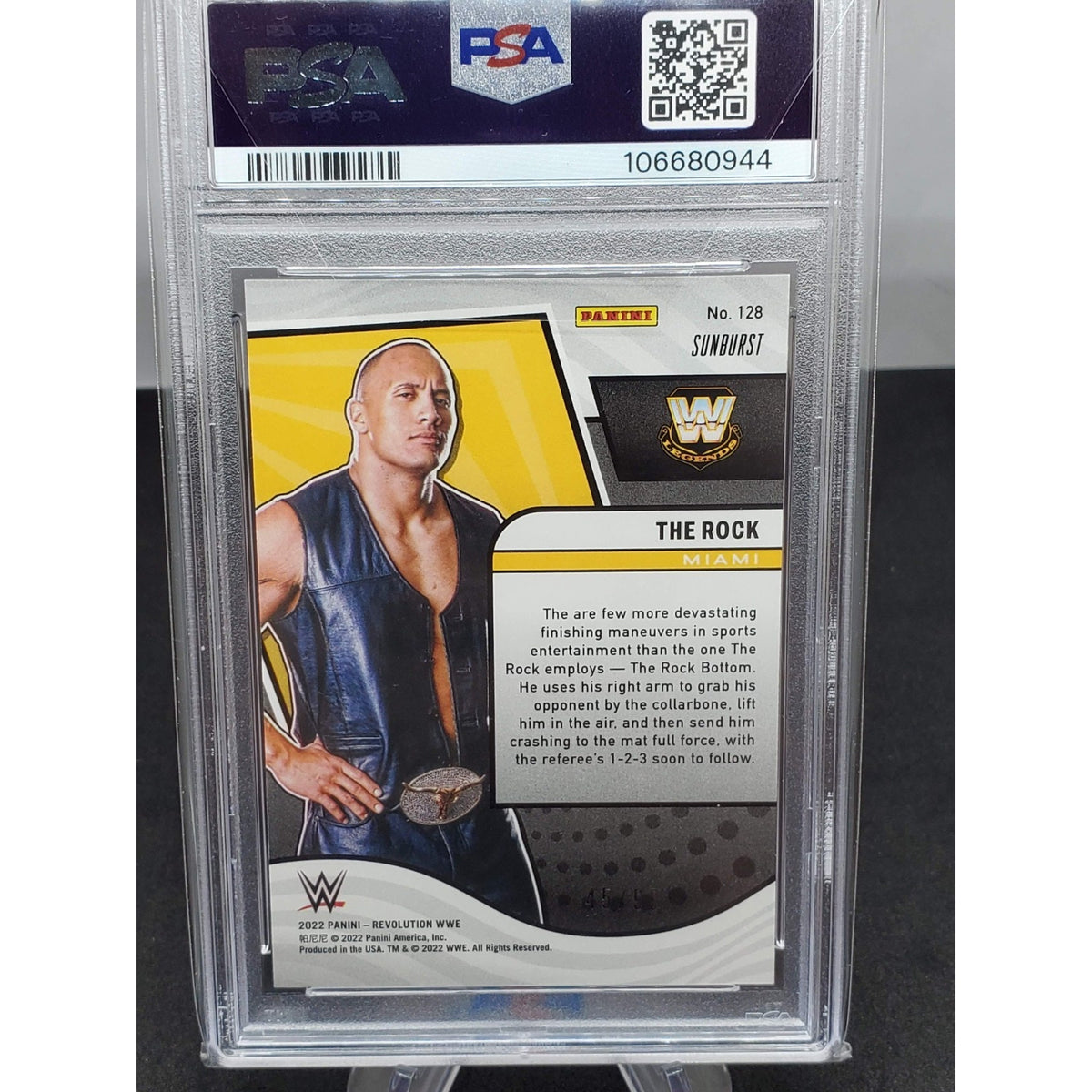 2022 Panini Revolution WWE The Rock Card WWE Sunburst #128 Low Pop PSA 9 #/99